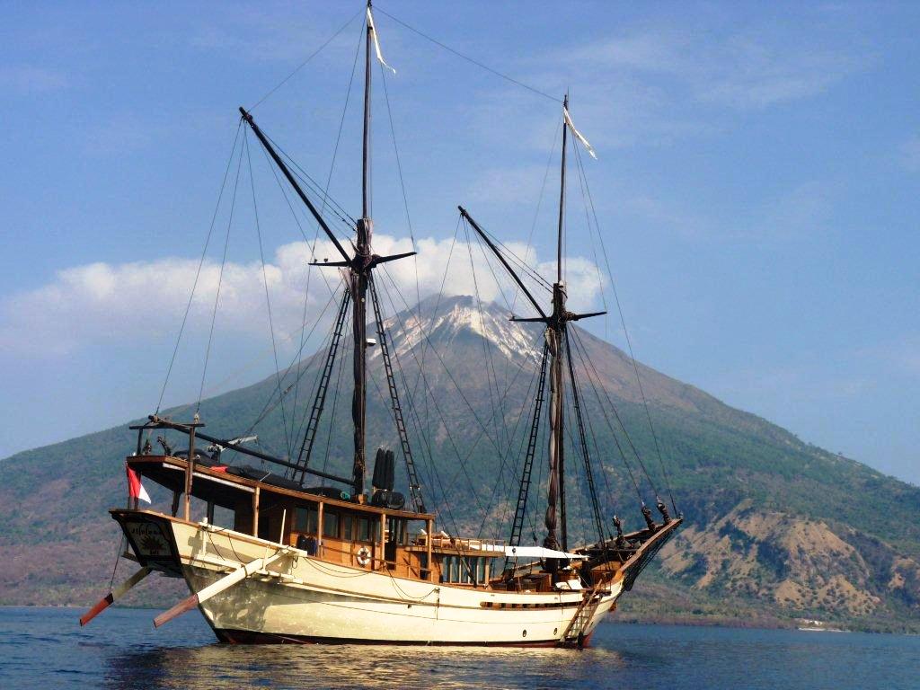 Silolona-anchored-in-front-of-active-volcano.jpg