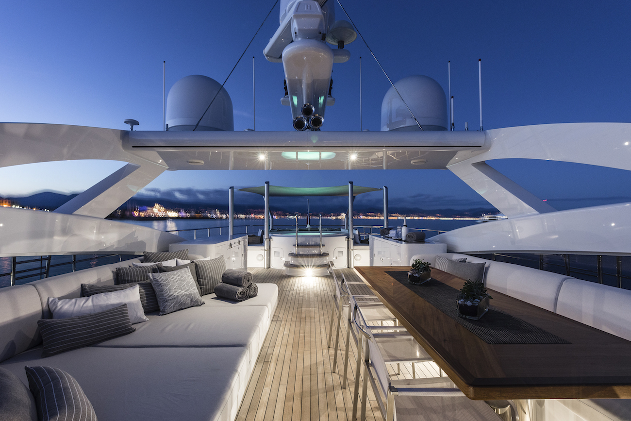 Sundeck Jacuzzi with alfresco dining and lounging area in the evening.jpg