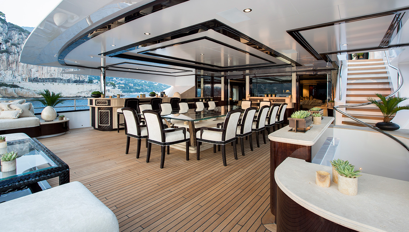 alfresco upper deck dining area with a huge table and elegant seating.jpg