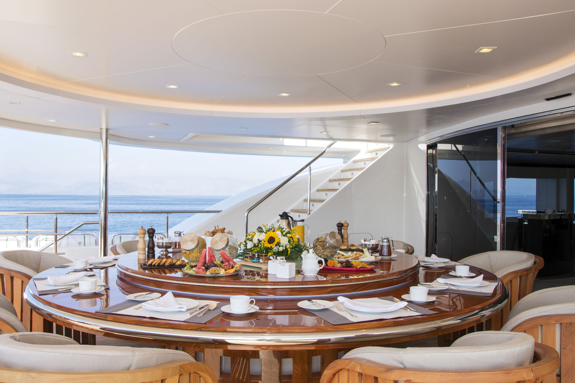 large circular aft deck dining table alfresco.jpg