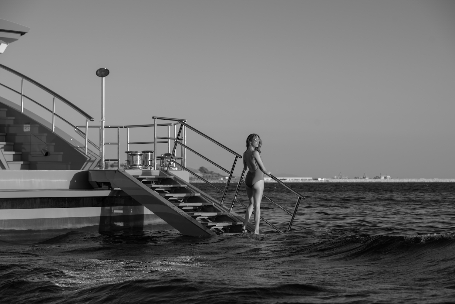 model walking into the water off the yacht.jpg
