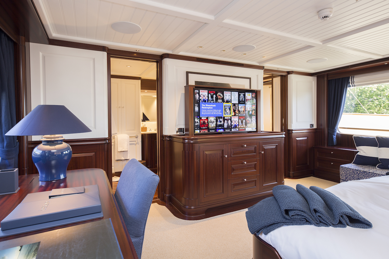 owners stateroom desk and popup tv.jpg