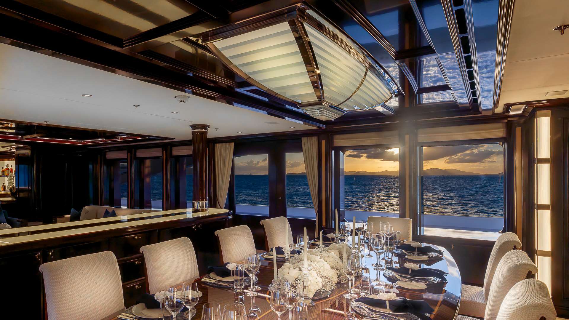 Rock It main deck - elegant dining set up credit Yachting Image.jpg
