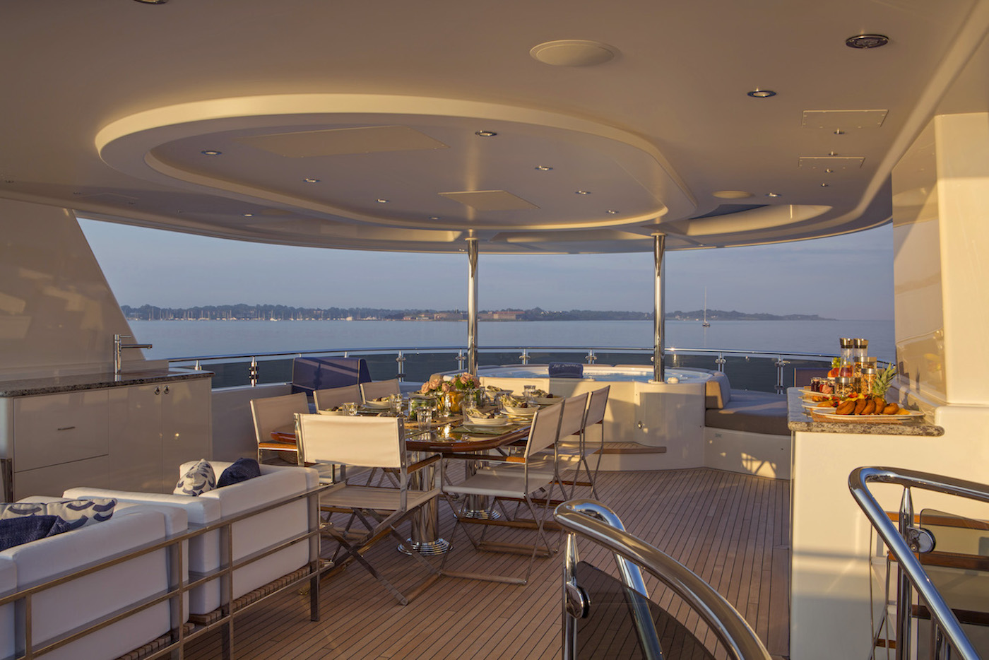 sun deck with alfresco dining and Jacuzzi.jpg