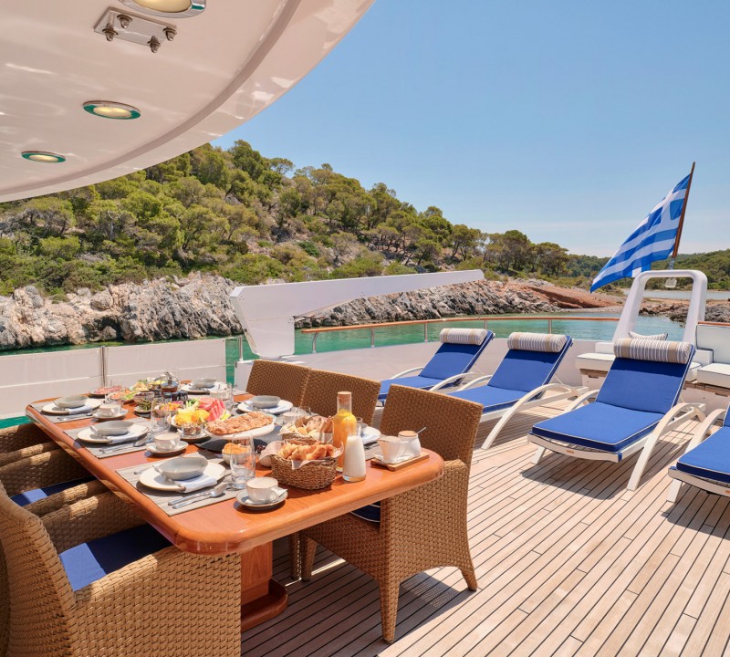 Upper deck dining and sun beds
