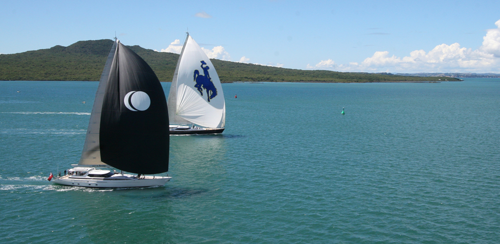 NZ Millennium Cup 2012: Day 1 - Sailing yacht Janice of Wyoming and Eclipse yacht battle it out while dormant volcano, Rangitoto, broods in the background.
Racing from day one of the Millennium Cup, Auckland, New Zealand