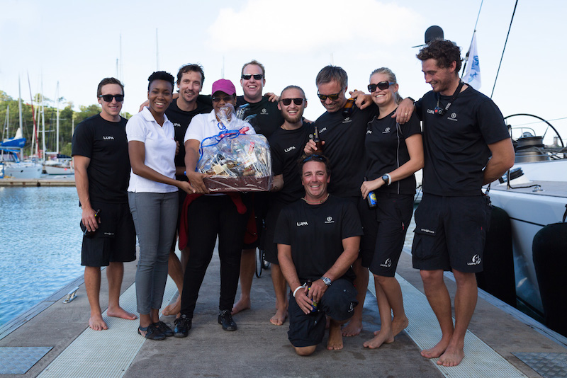 The crew of Lupa of London, Jeremy Pilkington's Baltic 78 receive a warm welcome on the dock in Grenada. As first yacht to complete the course, they will be presented with a sterling silver trophy by the International Maxi Association (IMA). © RORC/Orlando K Romain & Arthur Daniel