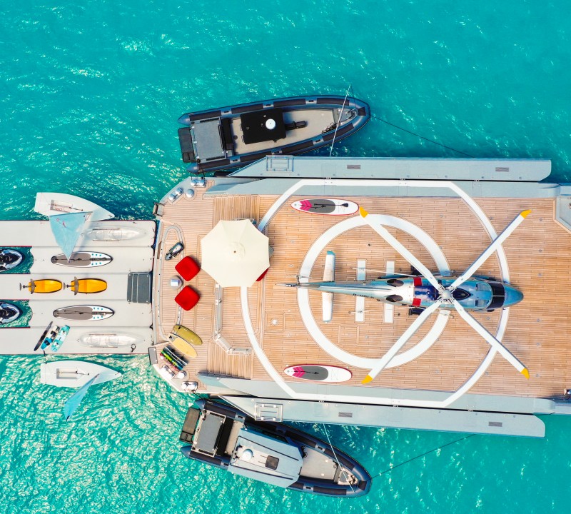 Aerial View Of The Yacht With Toys And Helicopter