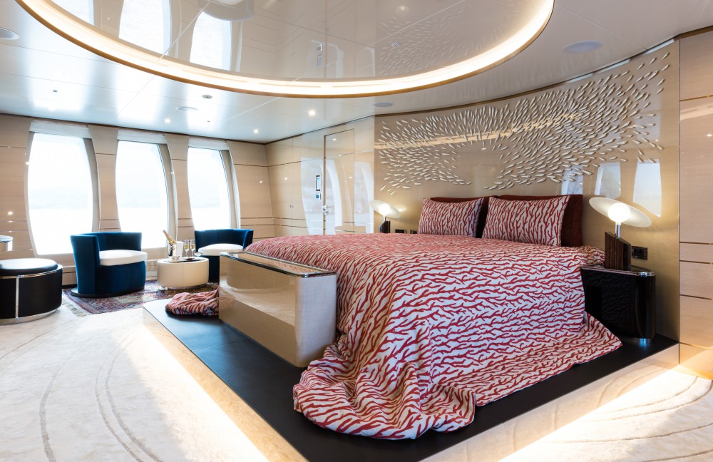 Master Suite With Beautiful Bedding And Seating Area