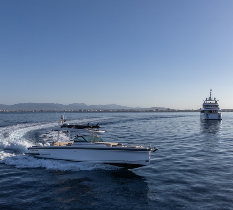 Tender With Yacht In Background